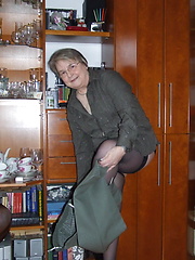 Granny dressed stockings and posing before our camera
