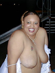 Fat chocolate woman posing outdoor